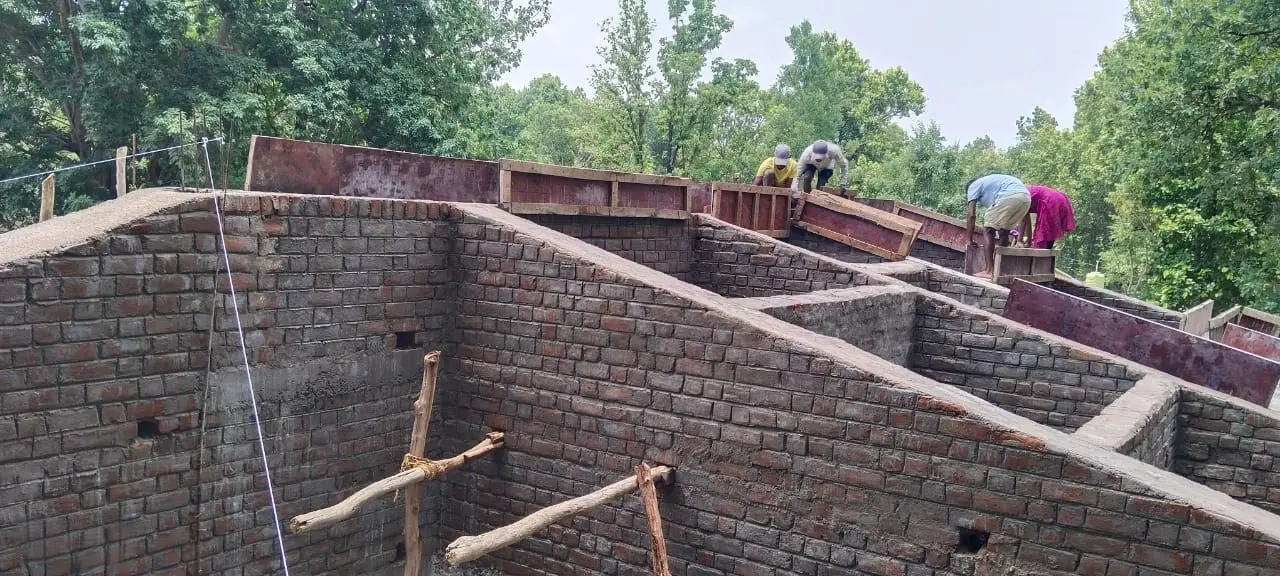 Formwork for the concrete roof band along the wall tops at Forest Rest House